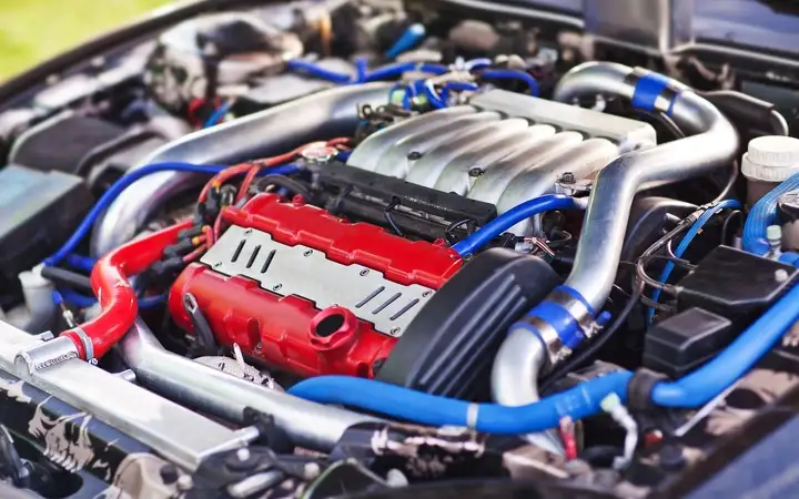 Vehicle engine with red and blue parts