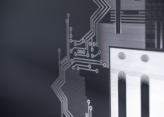 Glass panels that enable high-density interconnectors for advanced semiconductor packaging