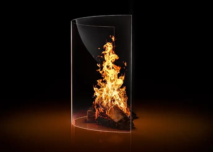 Crackling fire behind a curved ROBAX® fire-viewing panel