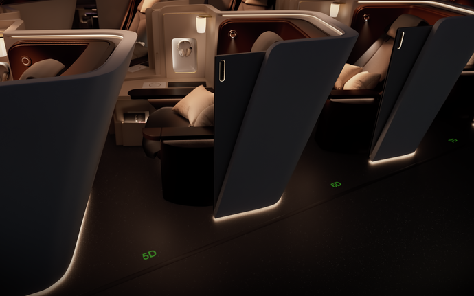 Row of aircraft seats with illuminated seat dividers and seat numbers projected on the dark cabin floor