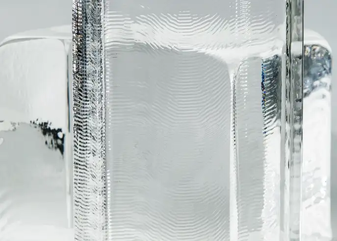 Close up of a clear block of optical glass