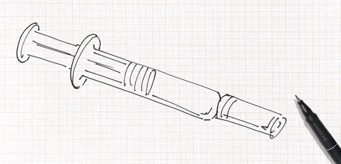 在纸上用笔画的注射器图