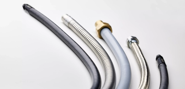 Ruggedized fiber optic assemblies with protective sheathing options for demanding environments