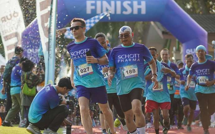 SCHOTT Employees running in matching shirts at a local run