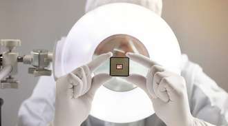 Person holding with both hands a chip