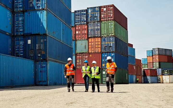 Logistics team at inland port with containers