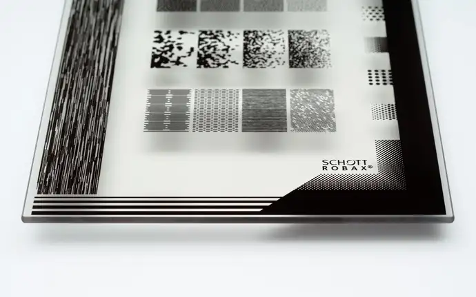 Flat transparent SCHOTT ROBAX® glass-ceramic fire-viewing panel with decoration in tin grey