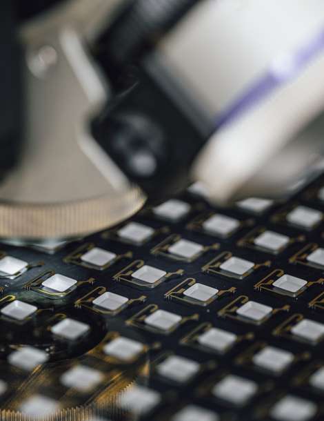 Wafer-level glass-to-glass sealed chip-scale packages for high-volume manufacturing